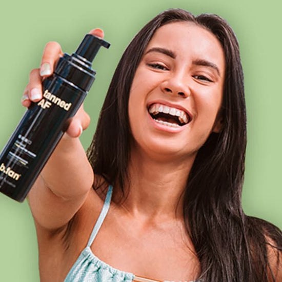 women is holding in hand minetan tanned af 